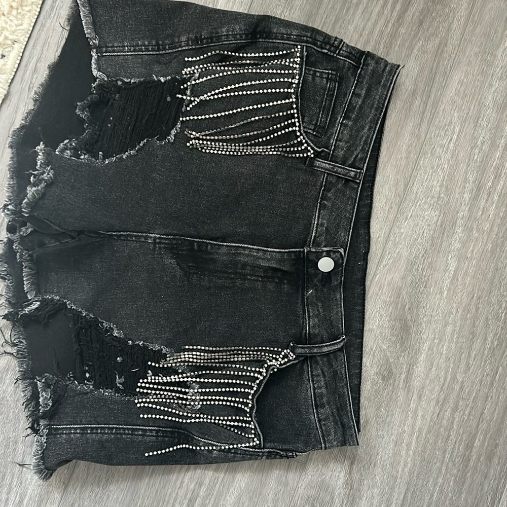 Never worn TAGS still on black distressed jean shorts
